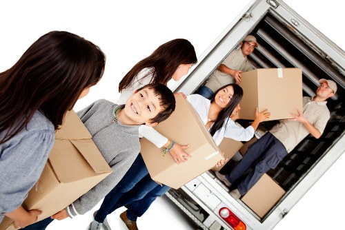 Removal team preparing boxes and furniture for a scheduled moving service