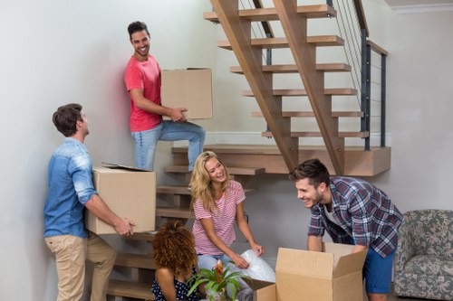 Packed moving boxes and household items ready for transport across Wales