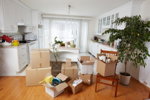 House move checklist and stacked moving boxes in a Welsh property