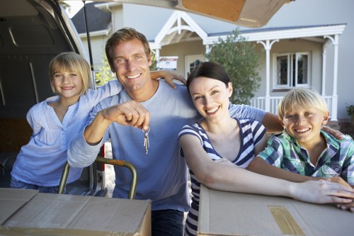 Professional movers carrying furniture during a house move