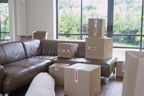Team using safe lifting techniques during a house move