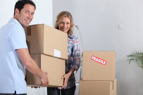 Professional movers handling office furniture during a Wales relocation